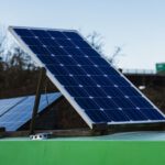 Solar Inverter Technology - blue and white solar panel on green metal bar during daytime