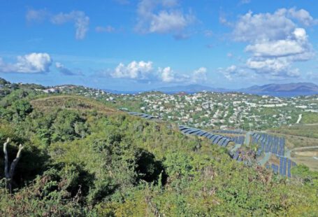 Community Solar Farm - a scenic view of a city from a hill
