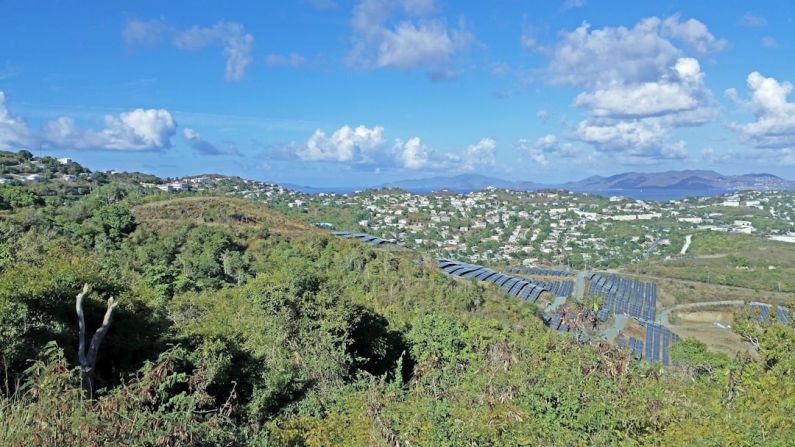 Community Solar Farm - a scenic view of a city from a hill