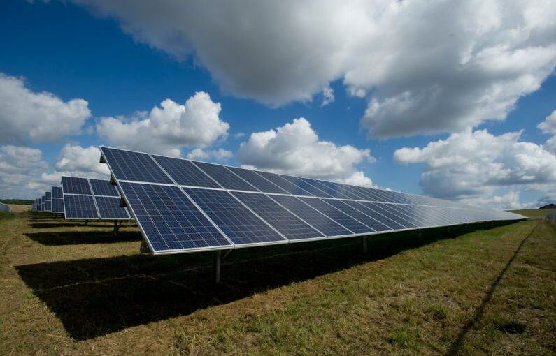 Payback Calculation Solar - solar panels on green field