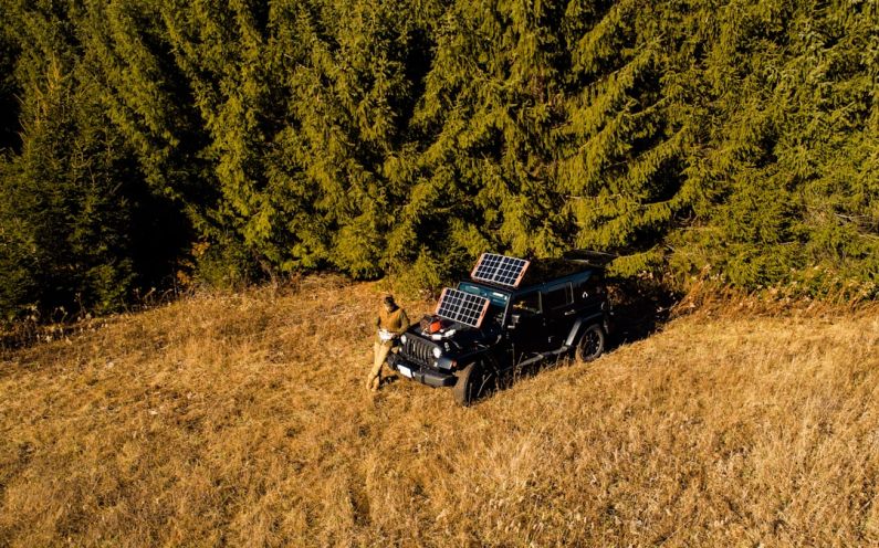 Portable Solar Generator - a dog sitting on a truck