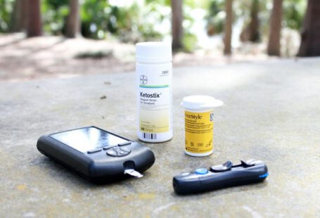 Solar Pond Pump - black smartphone beside white plastic bottle and black smartphone