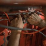 Solar Wiring Diagram - person holding red metal frame